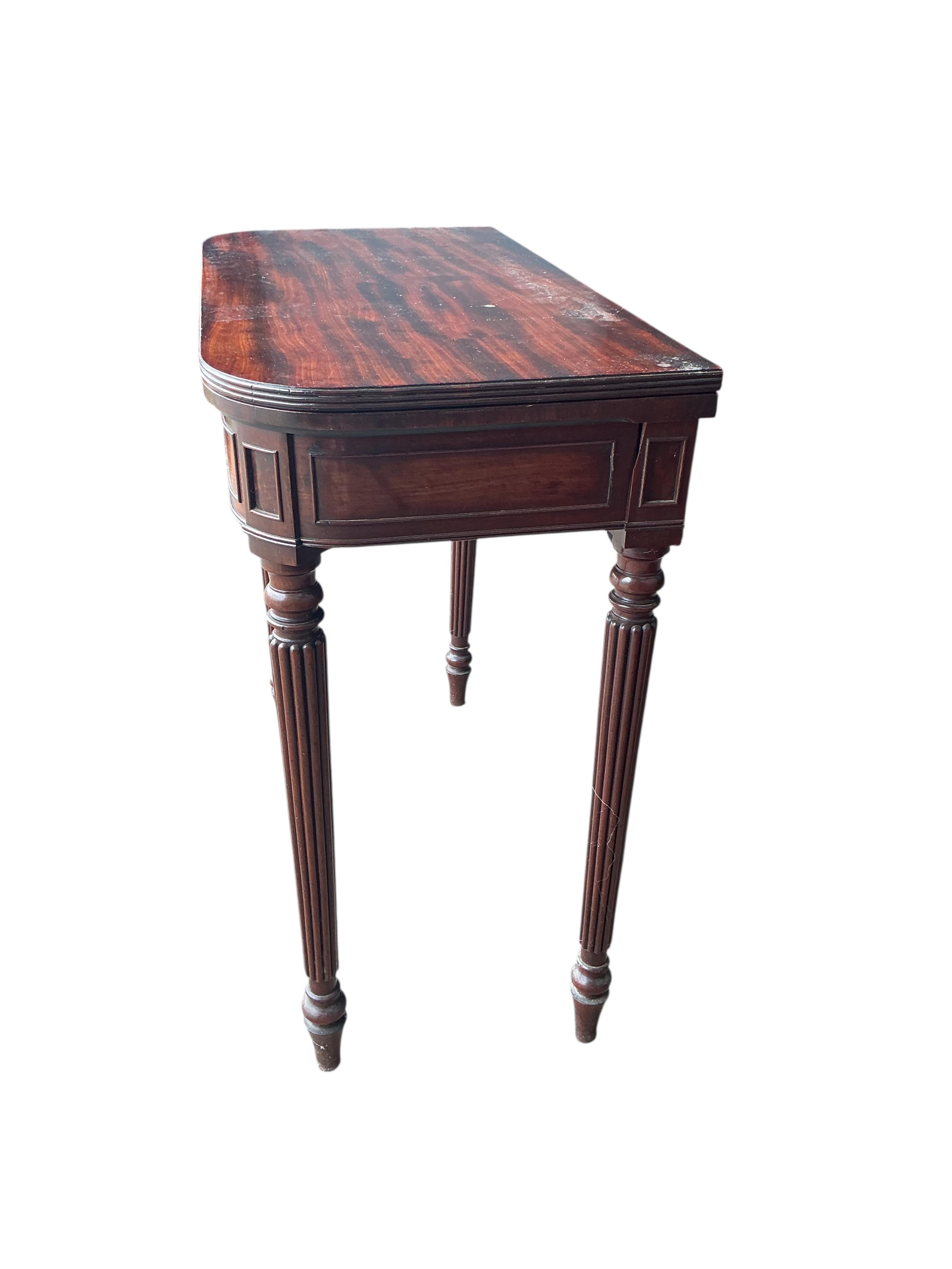 A Regency mahogany D-shaped folding tea table, width 76cm, depth 38cm, height 74cm